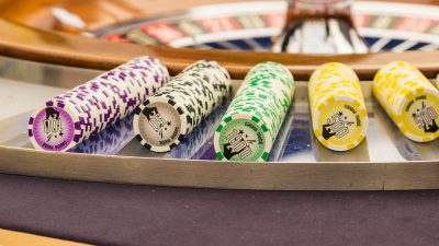 European roulette wheel spinning at a live dealer money casino table